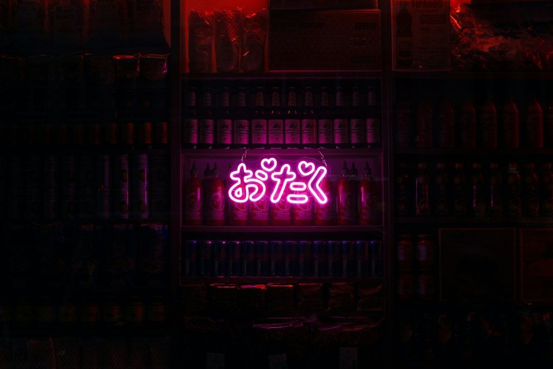 A neon sign in a dark room