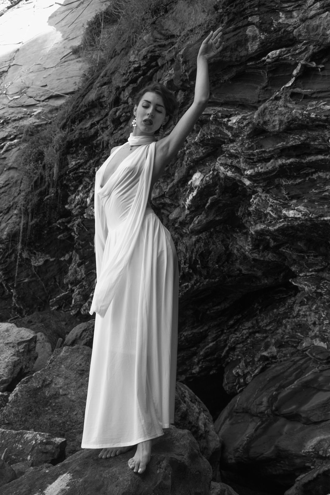 Nico dressed in white on sea rocks (Hires)
