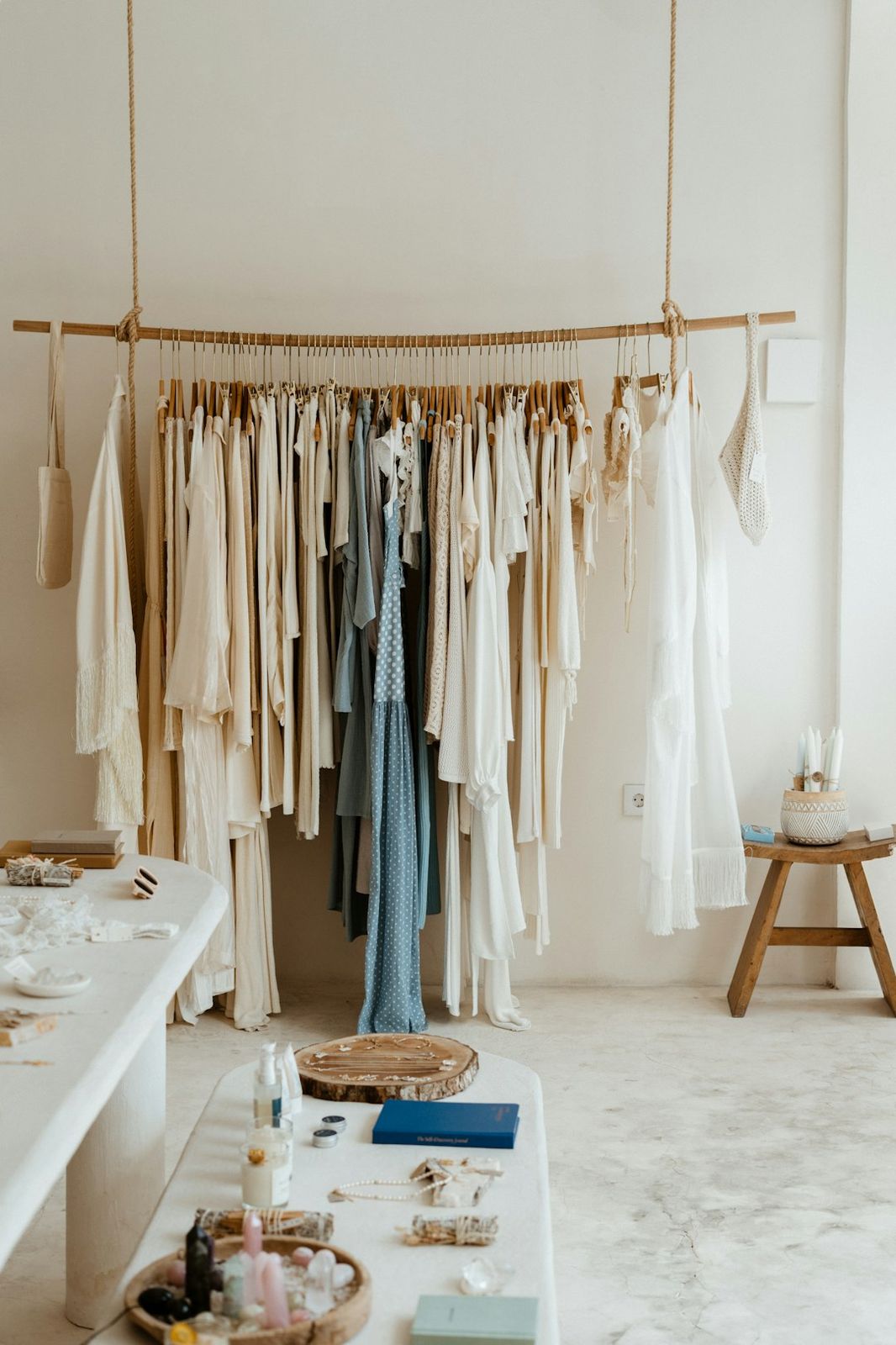 Clothes hanging on a rack in a boutique